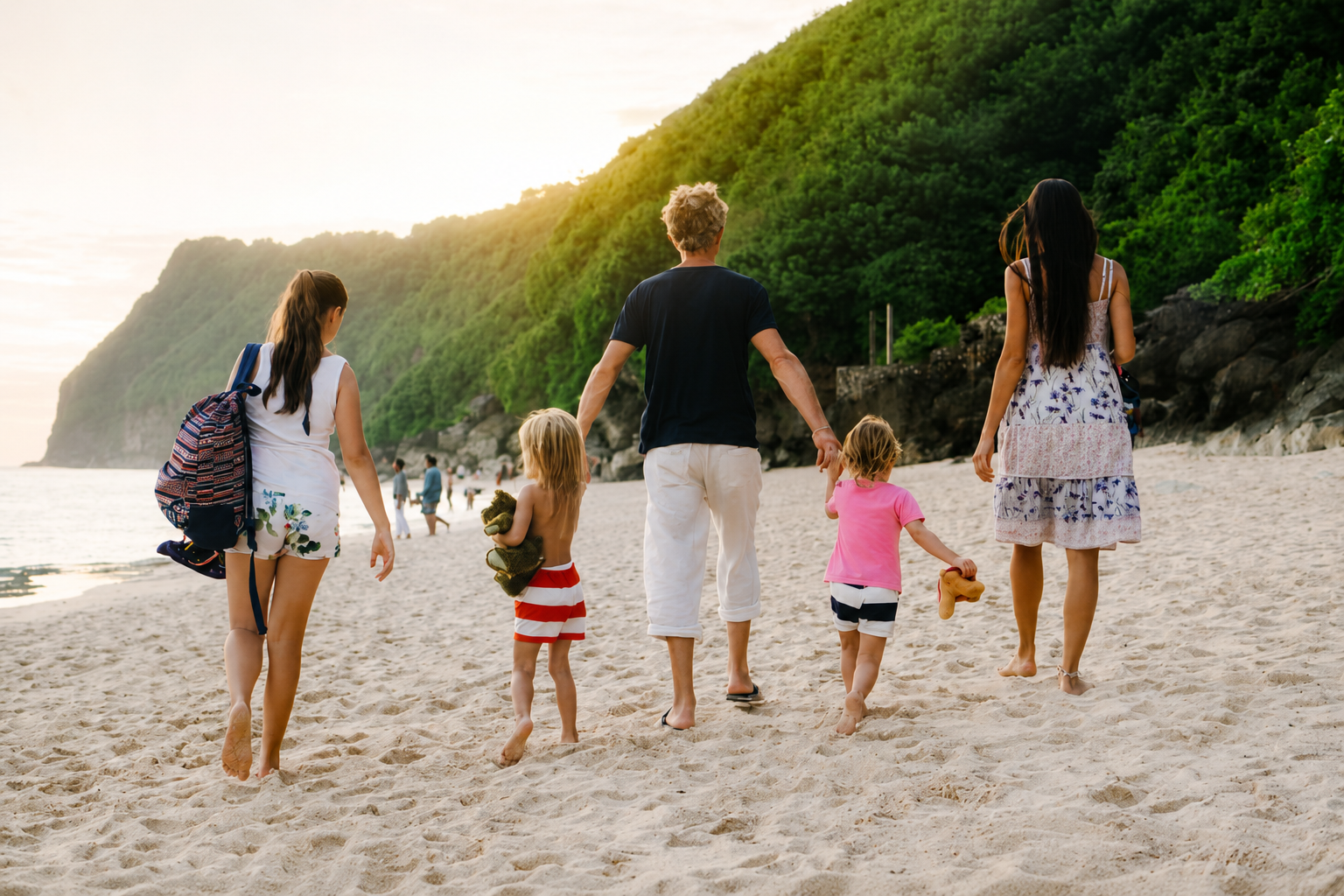 Family Walking On The Beach In Bali